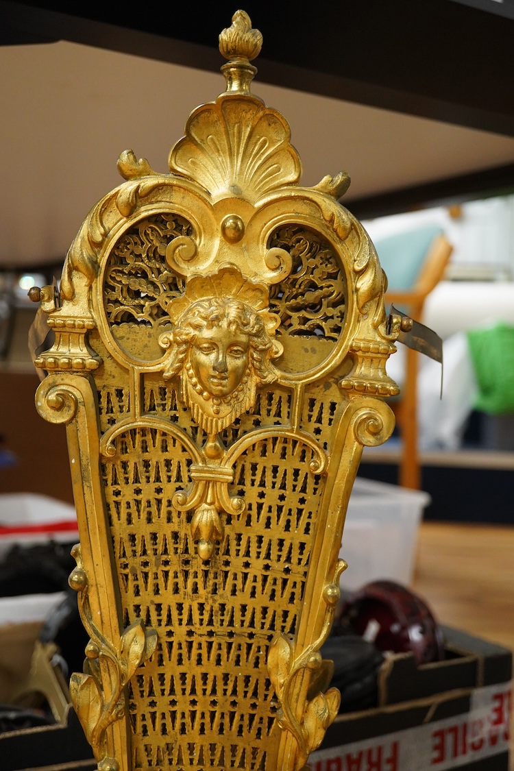 A 19th century cast gilt brass fan firescreen, 65cm high